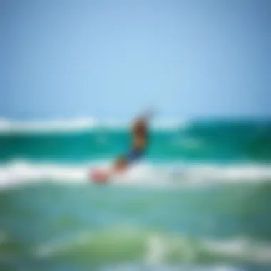 Kiteboarding Enthusiast on the Waves A kiteboarding enthusiast navigating the ocean waves with a duotone kite