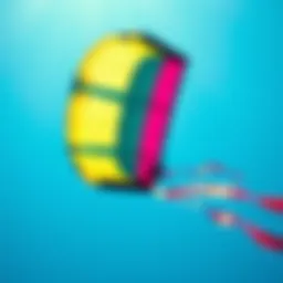 A vibrant duotone kite soaring across a blue sky