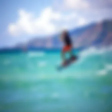Kiteboarder gliding over turquoise waters
