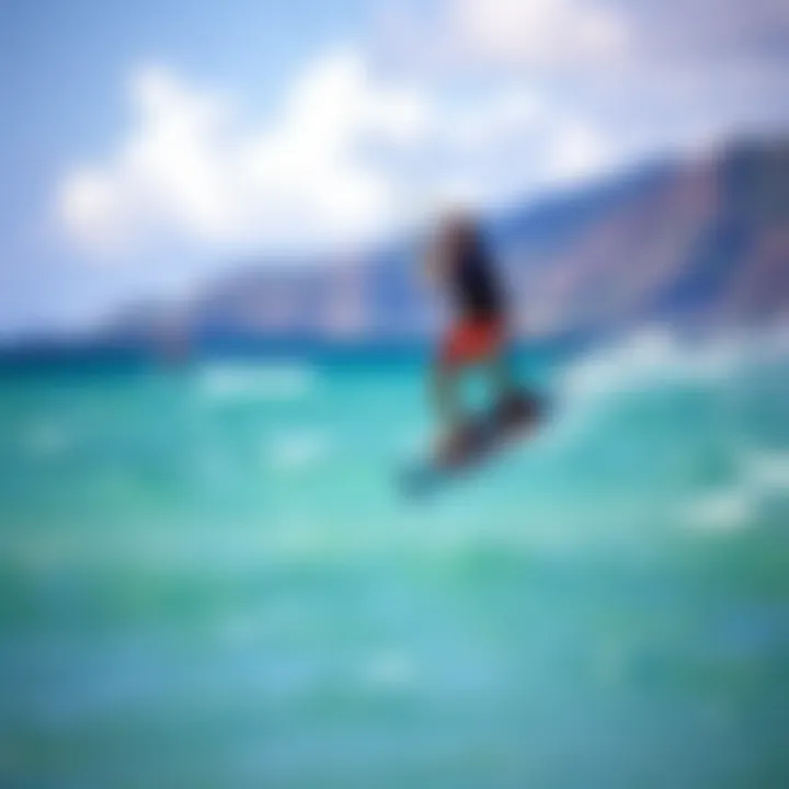 Kiteboarder gliding over turquoise waters