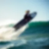 A sleek hydrofoiling surfboard gliding above the water surface