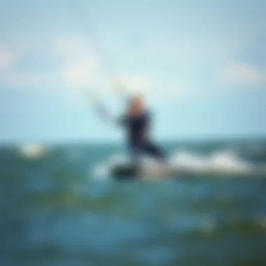 Mystic Marshall wetsuit in action during a kiteboarding session on the water.