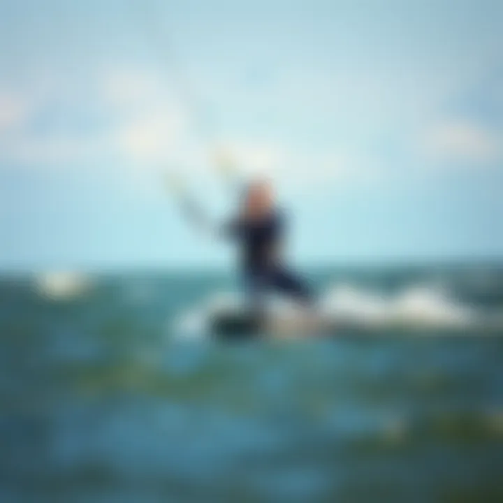 Mystic Marshall wetsuit in action during a kiteboarding session on the water.
