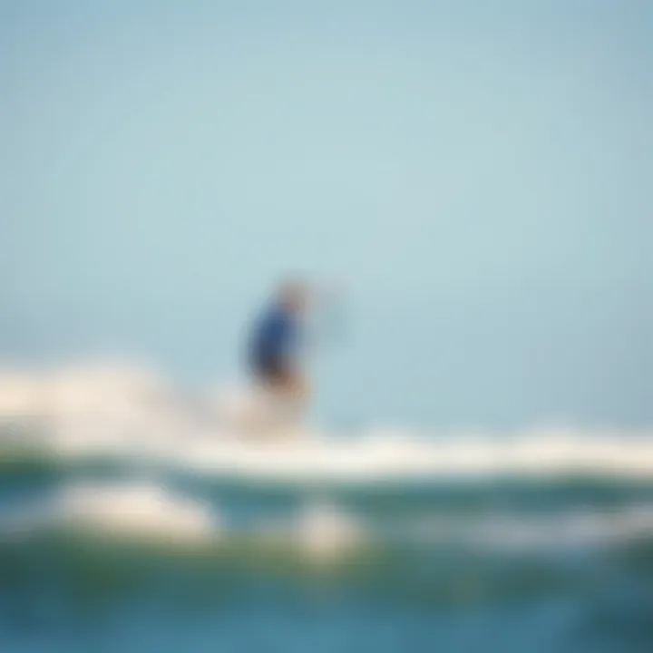 Action-Packed Kiteboarding in Jensen Beach Kiteboarder riding the waves under a clear blue sky in Jensen Beach