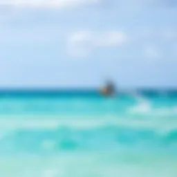 A kite surfer gliding over the turquoise waters of Tulum