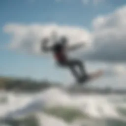A kiteboarder soaring above the ocean waves
