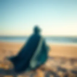 Quicksilver poncho displayed on a sandy beach