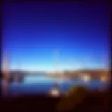 A panoramic view of Berkeley Marina with sailboats in the foreground