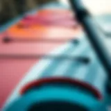 A close-up of the intricate design of a Slingshot SUP board showcasing its unique features