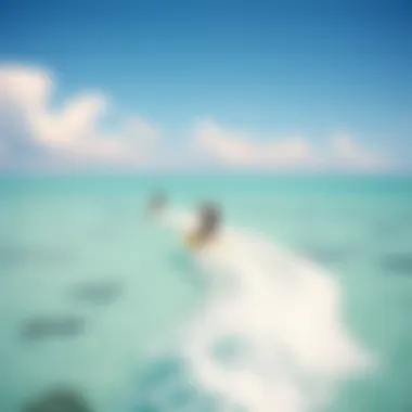 Kiteboarders in Action Above the Clear Waters Aerial view of kiteboarders riding the waves