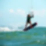 Kiteboarder gliding over water showcasing liquid force dynamics