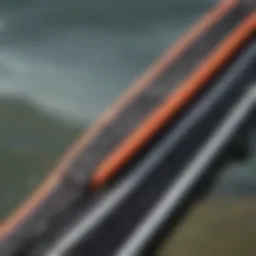 A close-up view of the V strap connection on a kiteboard