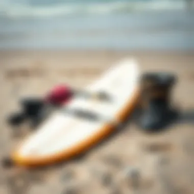 Essential Wing Foil Surfing Gear Essential gear for wing foil surfing laid out on the beach